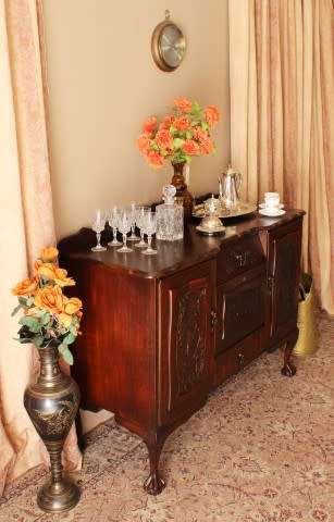 A gorgeous, large vintage Imbuia wood ball & claw buffet/ side server, with carved doors!