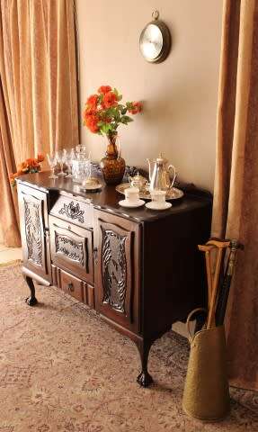 A gorgeous, large vintage Imbuia wood ball & claw buffet/ side server, with carved doors!