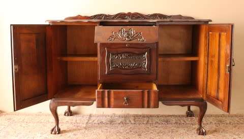 A gorgeous, large vintage Imbuia wood ball & claw buffet/ side server, with carved doors!