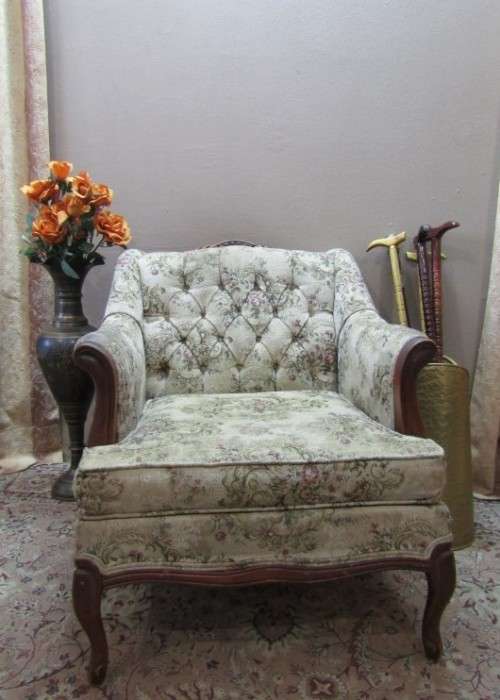 A gorgeous vintage Victorian styled arm chair w deep button, carved detailing & floral upholstery.