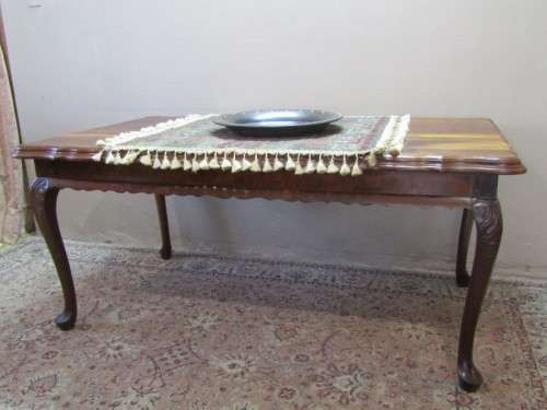 An exquisite solid Teak, scalloped edge, Queen Anne footed 6-seater dining table.