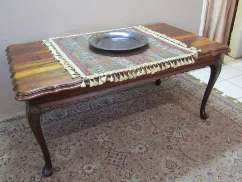 An exquisite solid Teak, scalloped edge, Queen Anne footed 6-seater dining table.