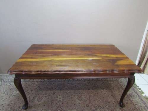 An exquisite solid Teak, scalloped edge, Queen Anne footed 6-seater dining table.