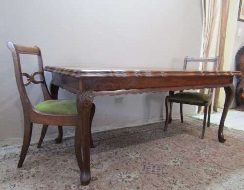 An exquisite solid Teak, scalloped edge, Queen Anne footed 6-seater dining table.