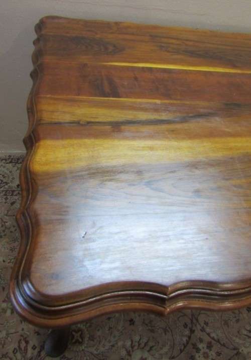 An exquisite solid Teak, scalloped edge, Queen Anne footed 6-seater dining table.