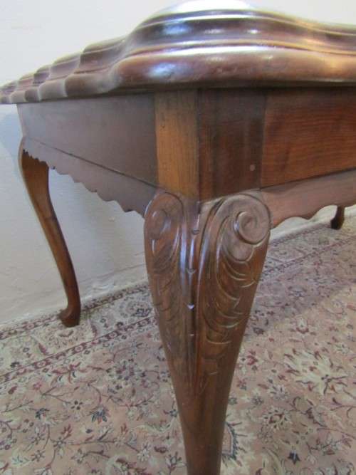 An exquisite solid Teak, scalloped edge, Queen Anne footed 6-seater dining table.