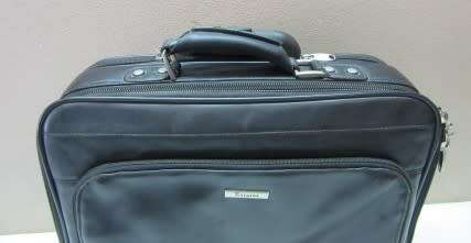 An awesome vintage black leather Laptop Trolley Bag suitcase on wheels.