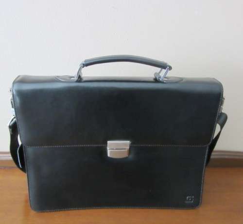 A beautiful genuine leather ladies hand bag with place for books, cards etc