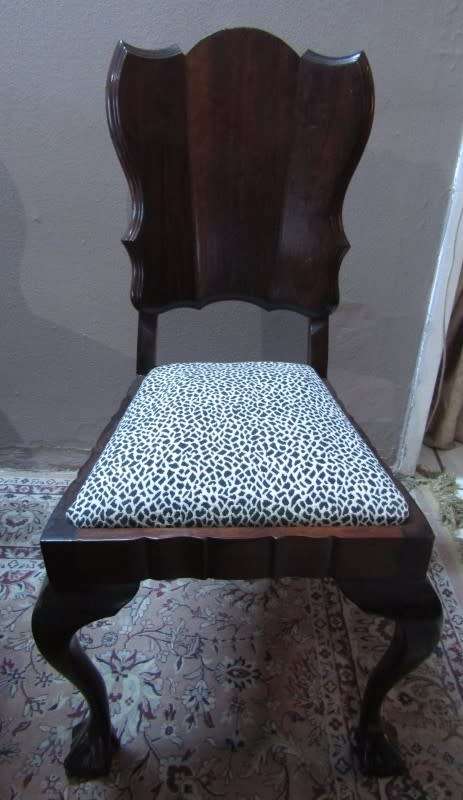 A wonderful solid Imbuia dining suite with a large round table and 8 x upholstered chairs