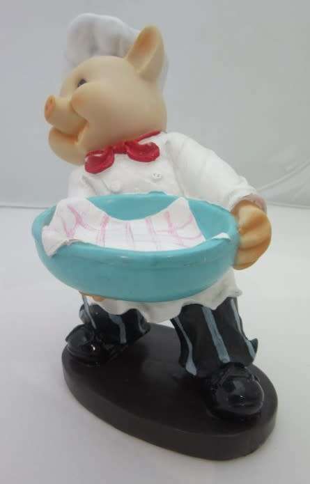 A magnificent hand crafted resin mold, hand painted pig chef statue. Amazing on display.