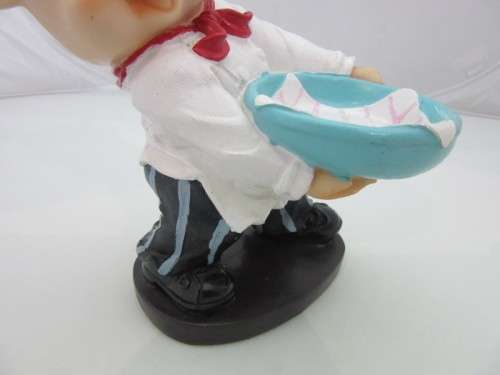 A magnificent hand crafted resin mold, hand painted pig chef statue. Amazing on display.
