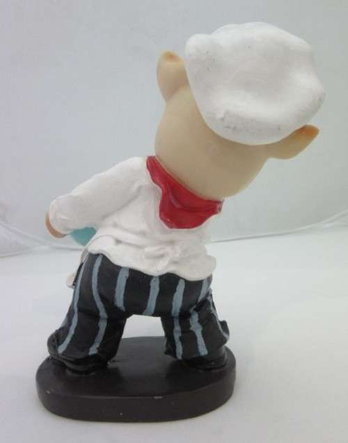 A magnificent hand crafted resin mold, hand painted pig chef statue. Amazing on display.
