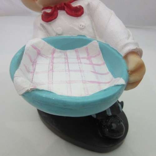 A magnificent hand crafted resin mold, hand painted pig chef statue. Amazing on display.