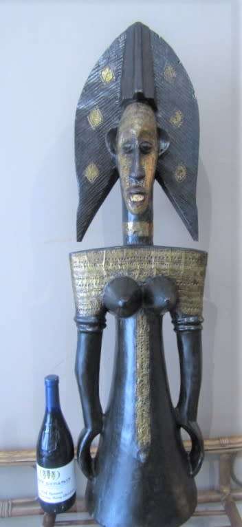 A fantastic large traditional hand carved double sided African mask with brass detailing!