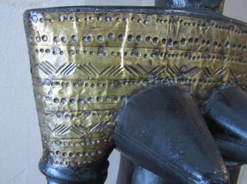 A fantastic large traditional hand carved double sided African mask with brass detailing!