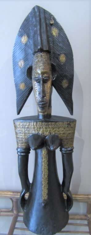 A fantastic large traditional hand carved double sided African mask with brass detailing!