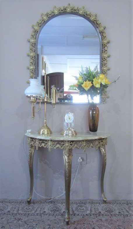 An exquisite moulded solid brass mirror & marble half moon table with ornate detailing. Wow!!!
