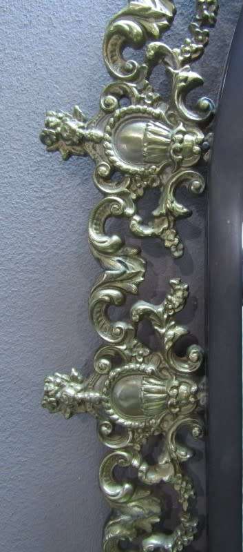 An exquisite moulded solid brass mirror & marble half moon table with ornate detailing. Wow!!!