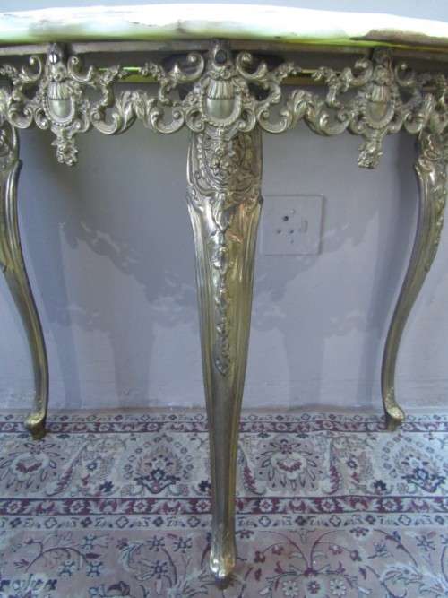 An exquisite moulded solid brass mirror & marble half moon table with ornate detailing. Wow!!!