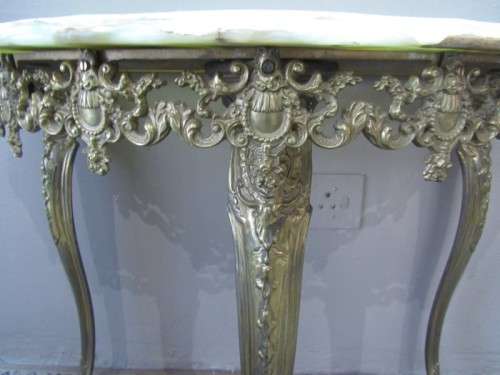 An exquisite moulded solid brass mirror & marble half moon table with ornate detailing. Wow!!!