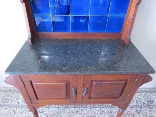 A wonderful vintage solid Oak double door wash stand with a black marble top on castors - stunning!!