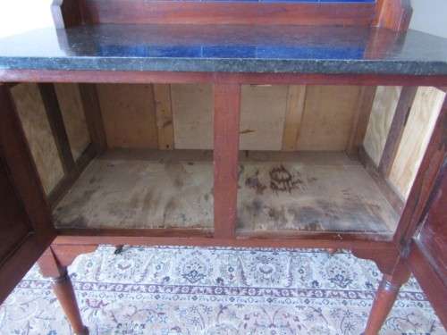 A wonderful vintage solid Oak double door wash stand with a black marble top on castors - stunning!!