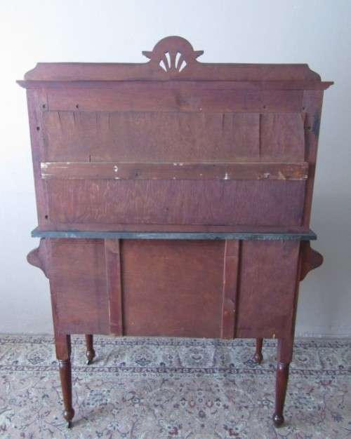 A wonderful vintage solid Oak double door wash stand with a black marble top on castors - stunning!!