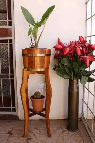 A superb vintage Teak double planter stand with a brass-ring bowl in wonderful condition.