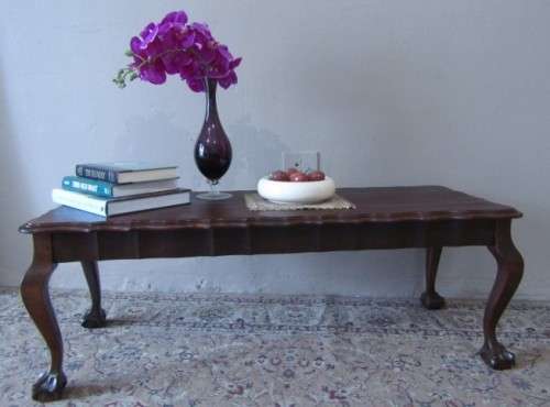 A  beautiful vintage solid Imbuia ball and claw centre coffee table.