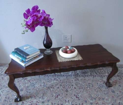 A  beautiful vintage solid Imbuia ball and claw centre coffee table.