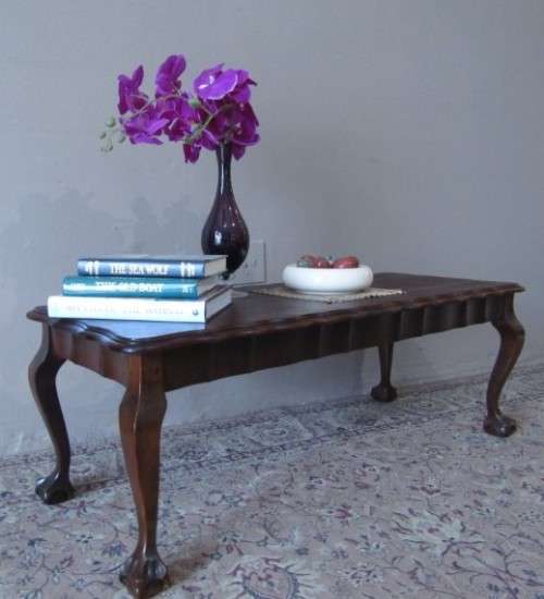 A  beautiful vintage solid Imbuia ball and claw centre coffee table.