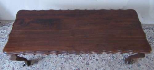 A  beautiful vintage solid Imbuia ball and claw centre coffee table.