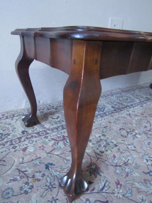 A  beautiful vintage solid Imbuia ball and claw centre coffee table.