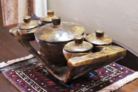 A  large hand carved teak serving bowl, with 4 bowls & 1 larger bowl in the center! Lifespace Sale