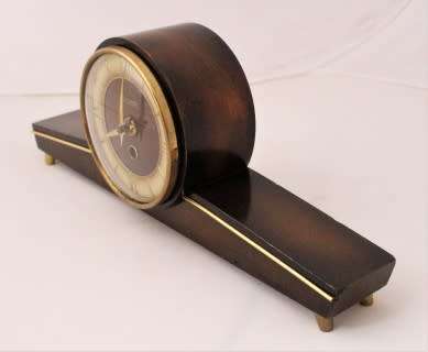 A beautiful wooden Mercedes mantel clock decorate with brass trimmings, working cold. Lifespace Sale