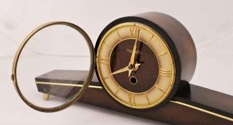 A beautiful wooden Mercedes mantel clock decorate with brass trimmings, working cold. Lifespace Sale