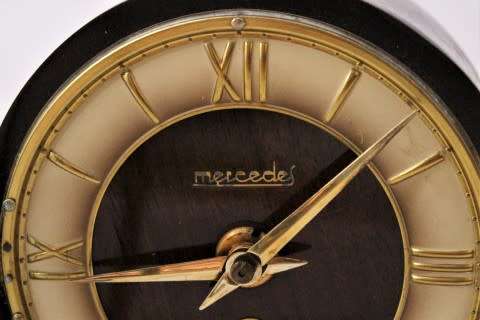 A beautiful wooden Mercedes mantel clock decorate with brass trimmings, working cold. Lifespace Sale