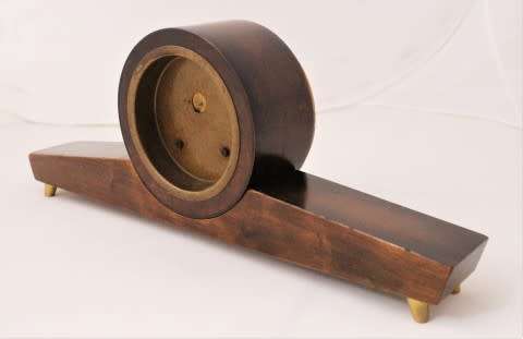 A beautiful wooden Mercedes mantel clock decorate with brass trimmings, working cold. Lifespace Sale