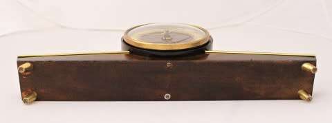 A beautiful wooden Mercedes mantel clock decorate with brass trimmings, working cold. Lifespace Sale