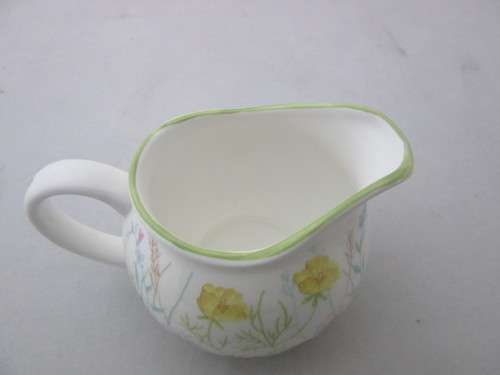 A gorgeous made in England "Nina Campbell" fine bone china milk jug/ creamer Meadow Flower pattern.