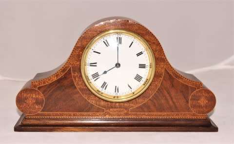 A stunning wooden antique Swiss made Buren mantel clock, in working condition!