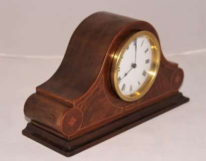 A stunning wooden antique Swiss made Buren mantel clock, in working condition!