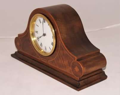 A stunning wooden antique Swiss made Buren mantel clock, in working condition!