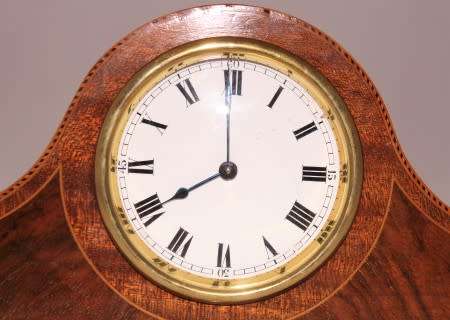 A stunning wooden antique Swiss made Buren mantel clock, in working condition!