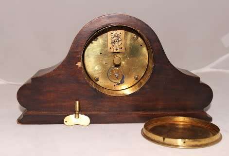 A stunning wooden antique Swiss made Buren mantel clock, in working condition!
