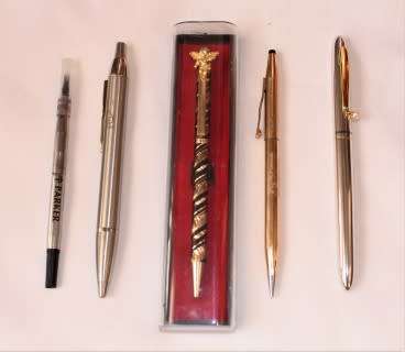 An awesome collection of four pens, including a parker refill.
