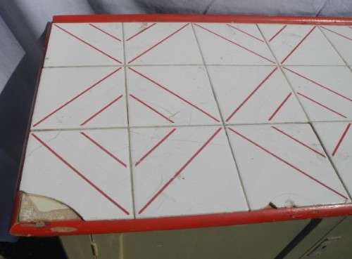 A wonderful vintage tile top multi purpose cabinet. Great restoration project!
