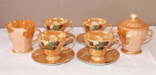 GORGEOUS electric orange tea set including 4 duos, milk jug and sugar pot.