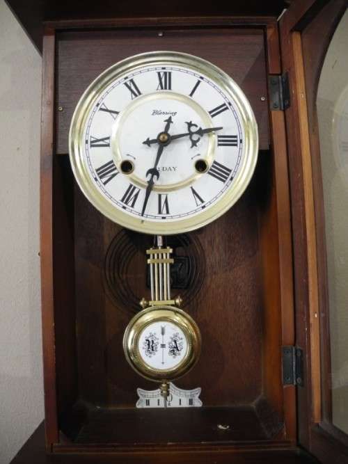 BARGAIN CLOCKS!!A vintage Blessing 31 day clock in a wood wall casing. Lifespace Sale