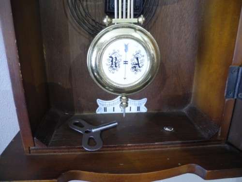 BARGAIN CLOCKS!!A vintage Blessing 31 day clock in a wood wall casing. Lifespace Sale